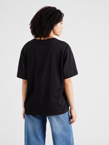Maglietta di GUESS JEANS in nero