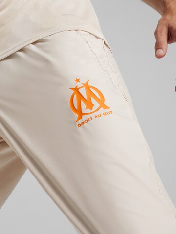 PUMA - Slimfit Pantalón deportivo 'OM Prematch' en beige