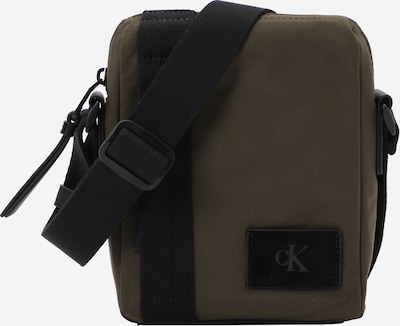 Rankinė su ilgu dirželiu iš Calvin Klein, spalva – alyvuogių spalva / juoda, Prekių apžvalga