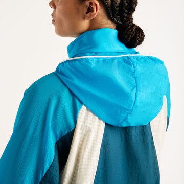 new balance - Chaqueta deportiva en azul