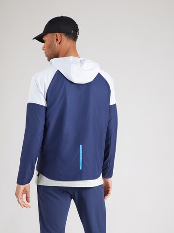 Veste mi-saison Nike Sportswear en bleu : derrière