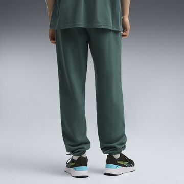 PUMA Regular Sports trousers in Green