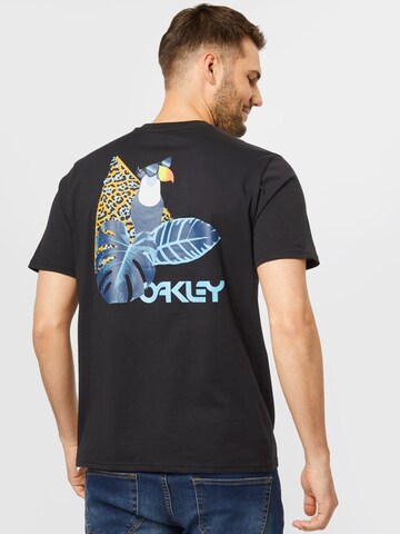 OAKLEY Λειτουργικό μπλουζάκι 'TOUCAN TROPICAL' σε μαύρο
