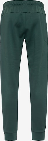 NIKE Tapered Athletic Pants in Green