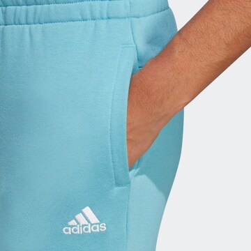 mėlyna ADIDAS SPORTSWEAR Siaurėjantis Sportinės kelnės 'Essentials'