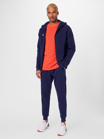 UNDER ARMOUR - Tapered Calças de desporto em azul