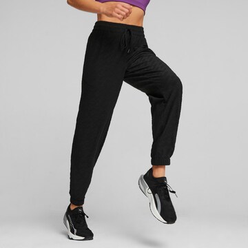 Tapered Pantaloni sportivi di PUMA in nero: frontale