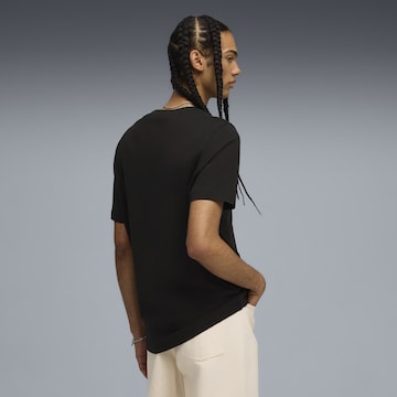 PUMA Shirt 'Play Different' in Zwart