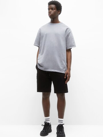 Regular Pantaloni cu buzunare de la Pull&Bear pe negru