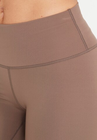 Athlecia Skinny Sporthose 'Almy' in Braun