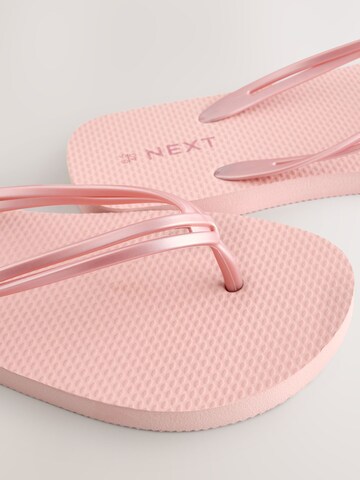 Tongs Next en or