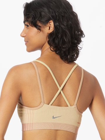 NIKE Bustier Urheilurintaliivit 'INDY' värissä vaaleanpunainen