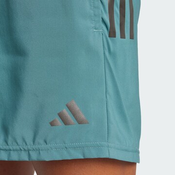 regular Pantaloni sportivi 'Own The Run' di ADIDAS PERFORMANCE in verde