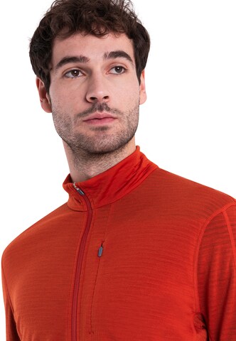 ICEBREAKER - Camiseta funcional 'Realfleece Descender' en naranja