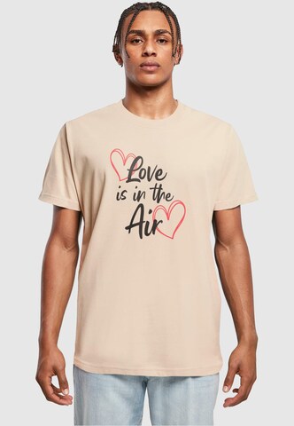 Merchcode T-Shirt 'Valentines Day - Love Is In The Air' in Beige: predná strana