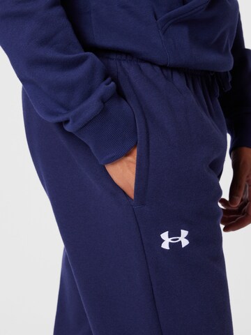 UNDER ARMOUR - Tapered Calças de desporto em azul