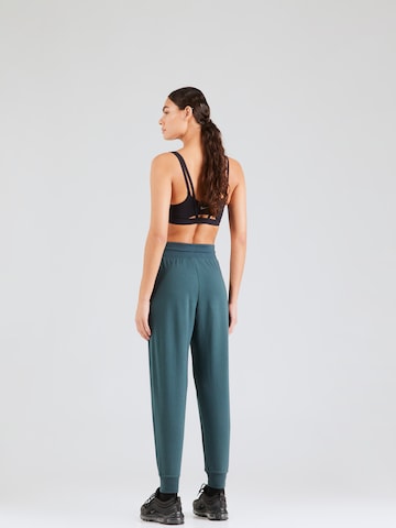 NIKE Tapered Sportbroek 'One' in Groen