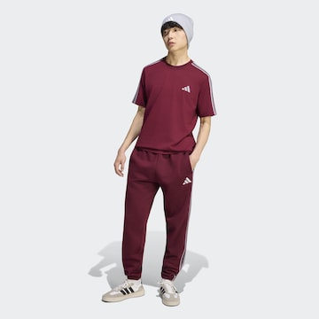 ADIDAS SPORTSWEAR Tapered Pants in Red