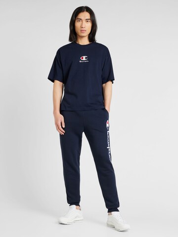 Champion Authentic Athletic Apparel Zwężany krój Spodnie w kolorze niebieski