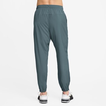 NIKE Tapered Workout Pants in Green