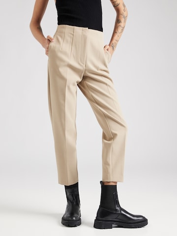 Marks & Spencer Tapered Trousers with creases in Beige: front