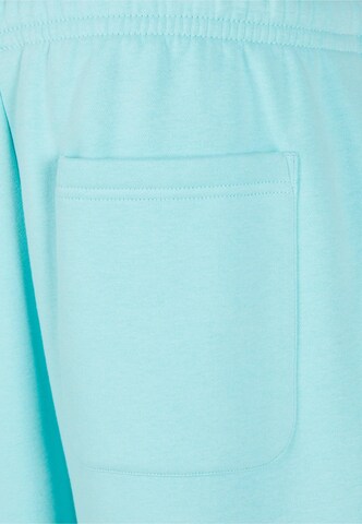 Tapered Pantaloni di Urban Classics in blu