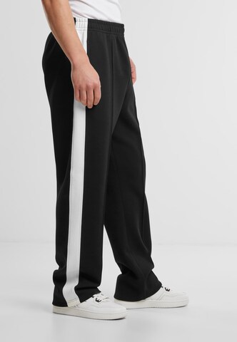 regular Pantaloni sportivi di Karl Kani in nero