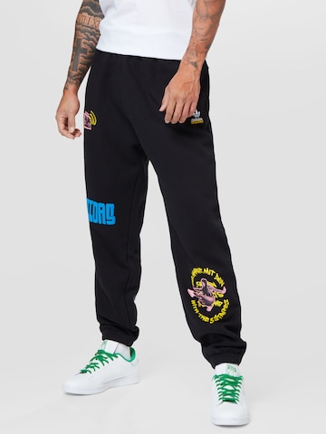 ADIDAS ORIGINALS Tapered Pants 'Graphics Unite Sweat' in Black: front