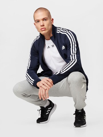 ADIDAS SPORTSWEAR Trainingsjacke 'Essentials Warm-Up' in Blau