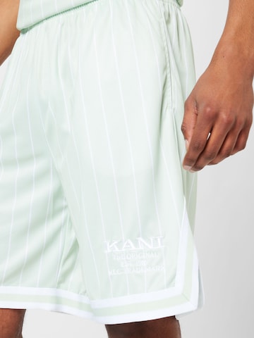 Regular Pantalon Karl Kani en vert