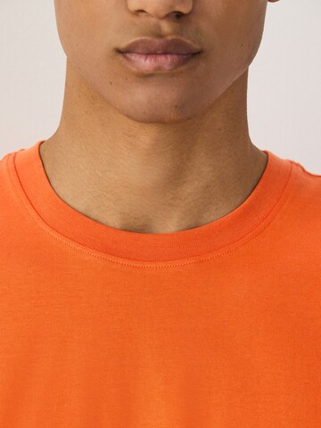 T-Shirt Next en orange