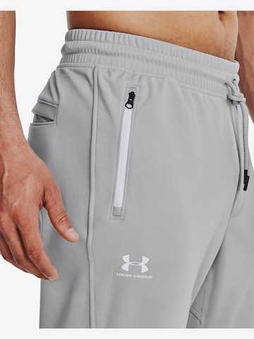 UNDER ARMOURTapered Sportske hlače - siva boja