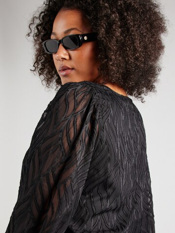 EVOKED - Blusa 'VITUTTA' en negro