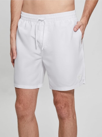 GUESS Board Shorts in White: front