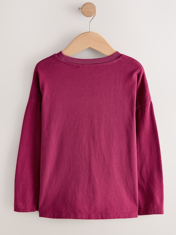Tricou de la Next pe roșu