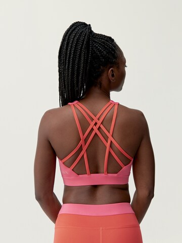 Born Living Yoga Sporttop 'Navani' in Oranje