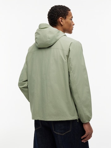 Tommy Jeans Tussenjas 'CHICAGO' in Groen