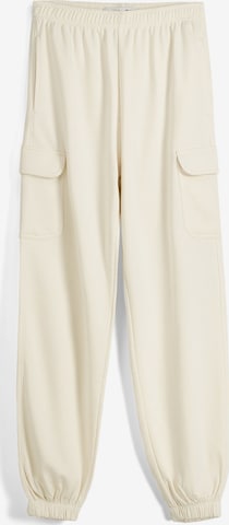 Bershka Tapered Nadrág - sárga: elől