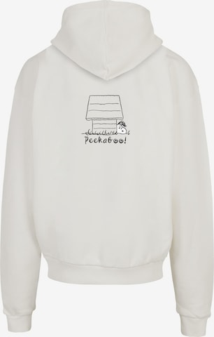 Sweat-shirt 'Peanuts - Peekaboo' Merchcode en blanc