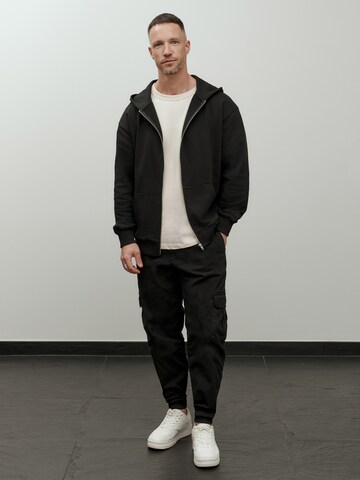 Veste de survêtement 'Essential' DAN FOX APPAREL en noir