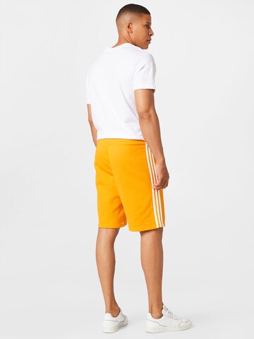 regular Pantaloni '3-Stripes' di ADIDAS ORIGINALS in giallo