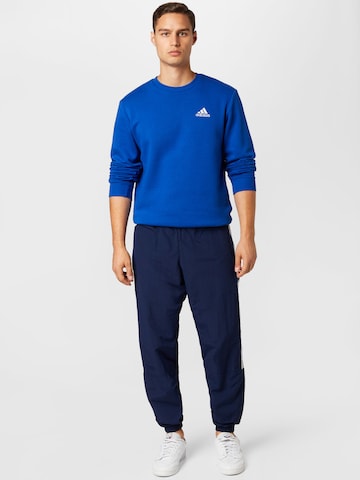 mėlyna ADIDAS SPORTSWEAR Sportinio tipo megztinis 'Essentials Fleece'