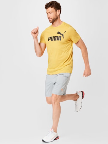 PUMA - Camiseta funcional en amarillo