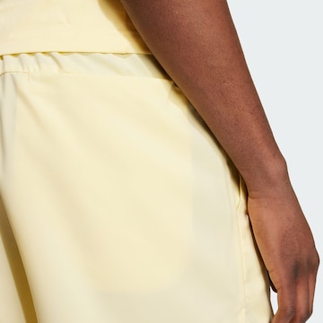 ADIDAS SPORTSWEAR Regular Workout Pants 'Essentials Chelsea' in Yellow