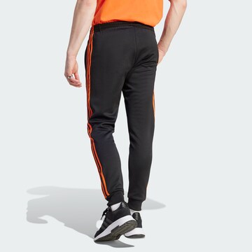 ADIDAS ORIGINALS Zwężany krój Spodnie 'Adicolor Classics Sst' w kolorze czarny