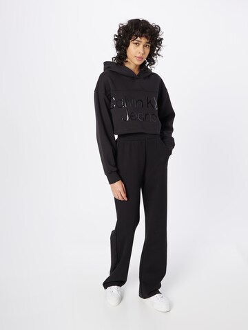 Sweat-shirt Calvin Klein Jeans en noir : devant