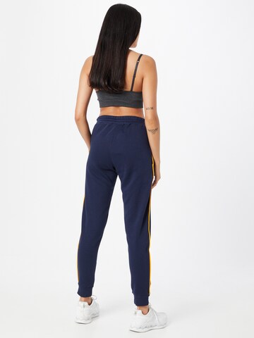 Effilé Pantalon de sport Reebok en bleu