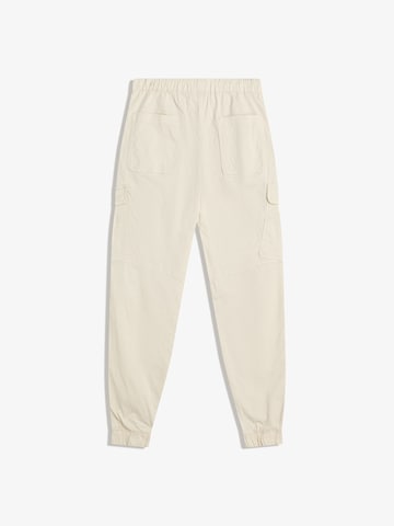 Bershka Tapered Cargo nadrágok - sárga