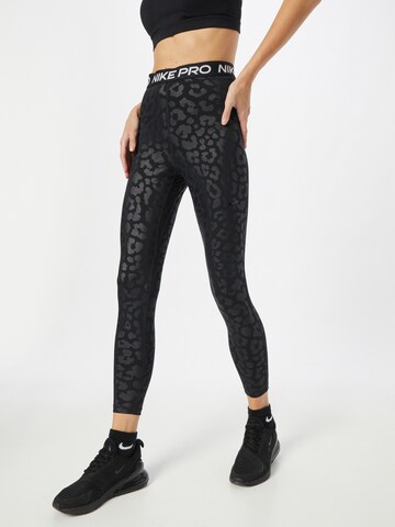 NIKE Skinny Sportbroek in Zwart: voorkant