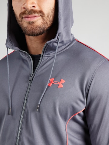 Completo per l'allenamento 'Novelity' di UNDER ARMOUR in grigio